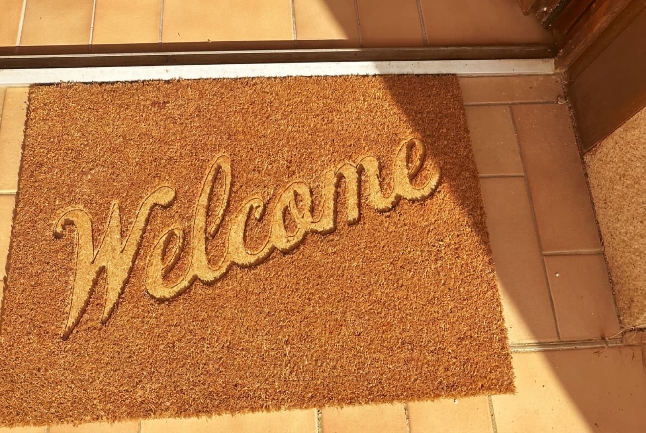 Paillasson « Welcome » à l'entrée du gîte de la retraite créative à Fontaine-le-Comte